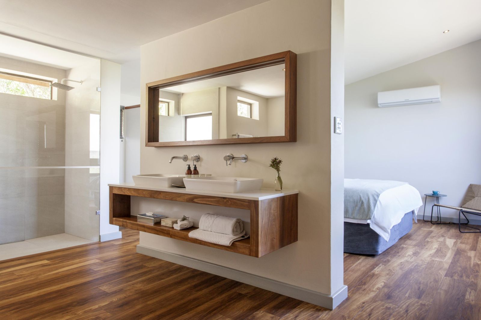 Open plan bathroom in main bedroom of garden cottage at luxury lodge Grootbos Garden Lodge in South Africa