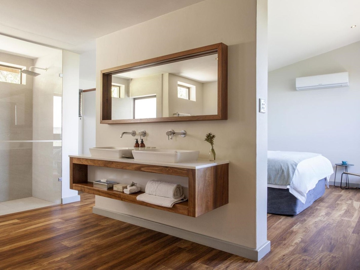 Open plan bathroom in main bedroom of garden cottage at luxury lodge Grootbos Garden Lodge in South Africa