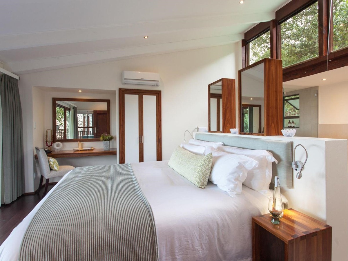 Garden suite bedroom with garden view at luxury lodge Grootbos Garden Lodge in South Africa