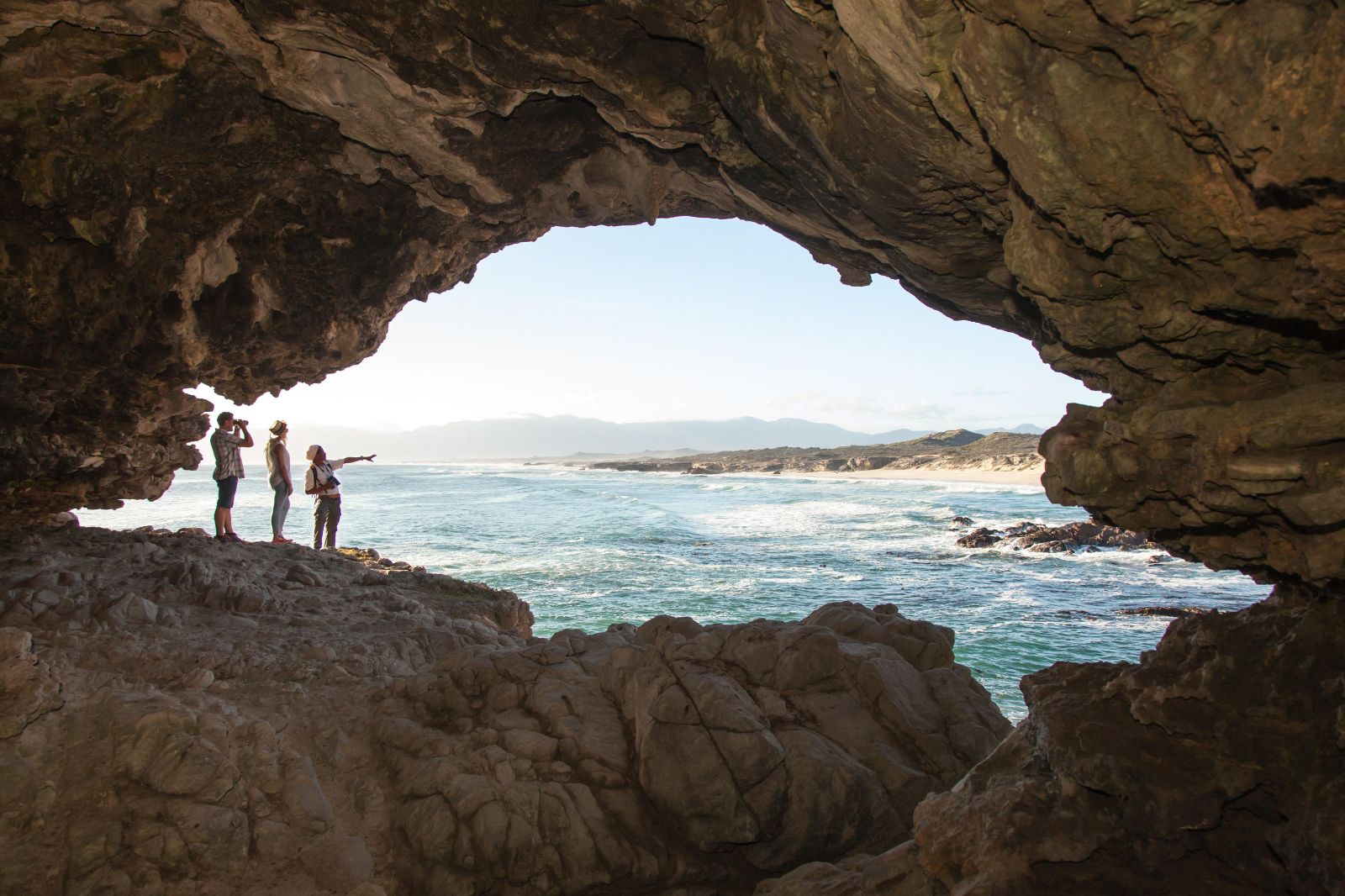 Guests enjoying a guided cave tour during a stay at luxury reserve Grootbos in South Africa