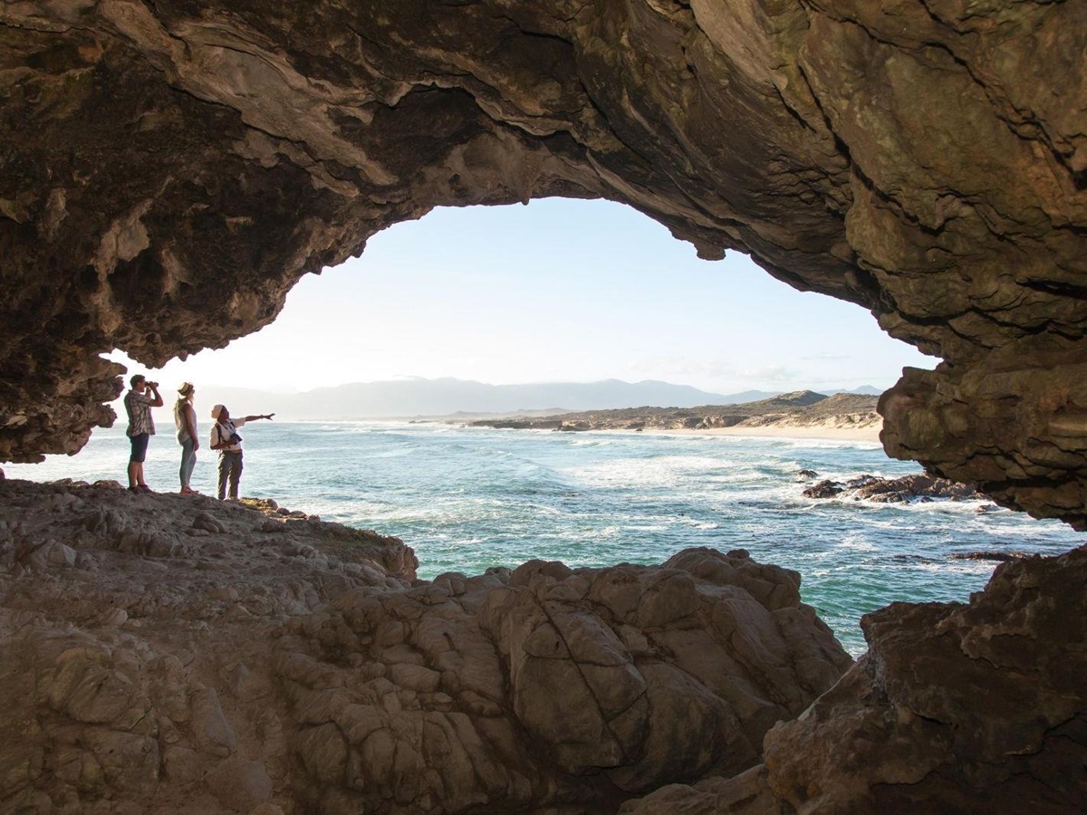 Guests enjoying a guided cave tour during a stay at luxury reserve Grootbos in South Africa
