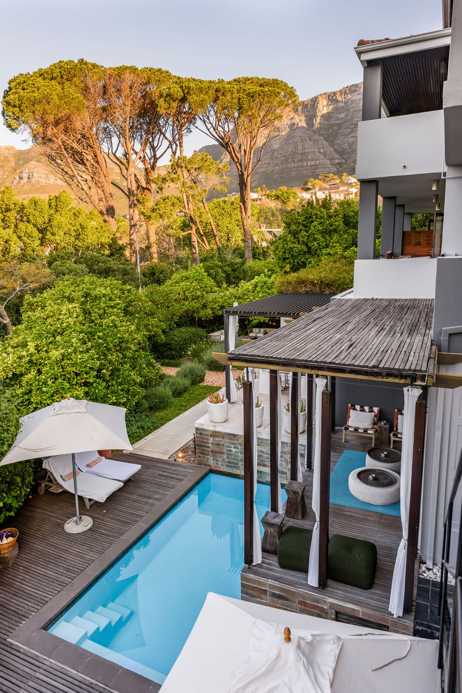 Serene blue pool with views of Table Mountain at luxury hotel Kensington Place in Cape Town South Africa