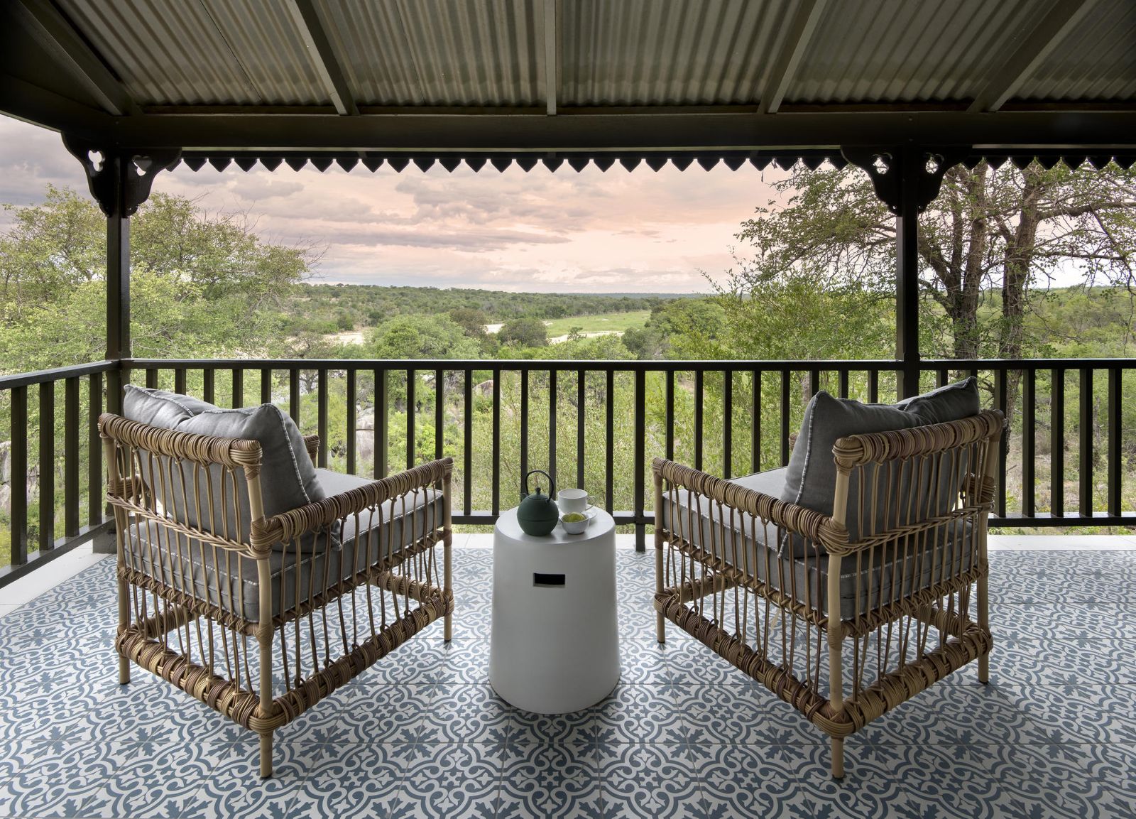 Two chairs on a private terrace at luxury safari lodge Kirkman's Kamp overlooking the Sabi Sands Game Reserve