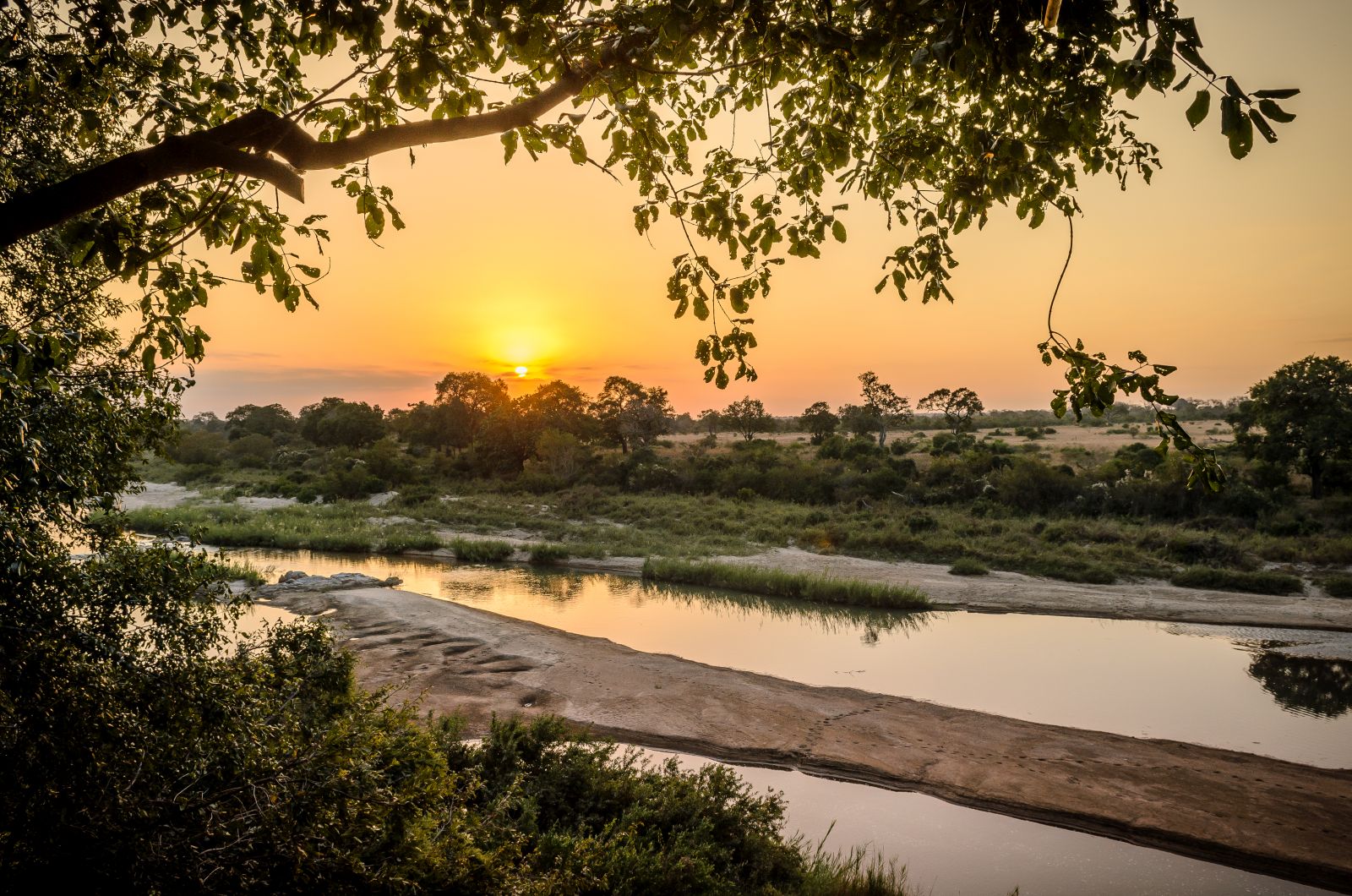 Sunset view over the river at Singita Boulders Lodge in South Africa