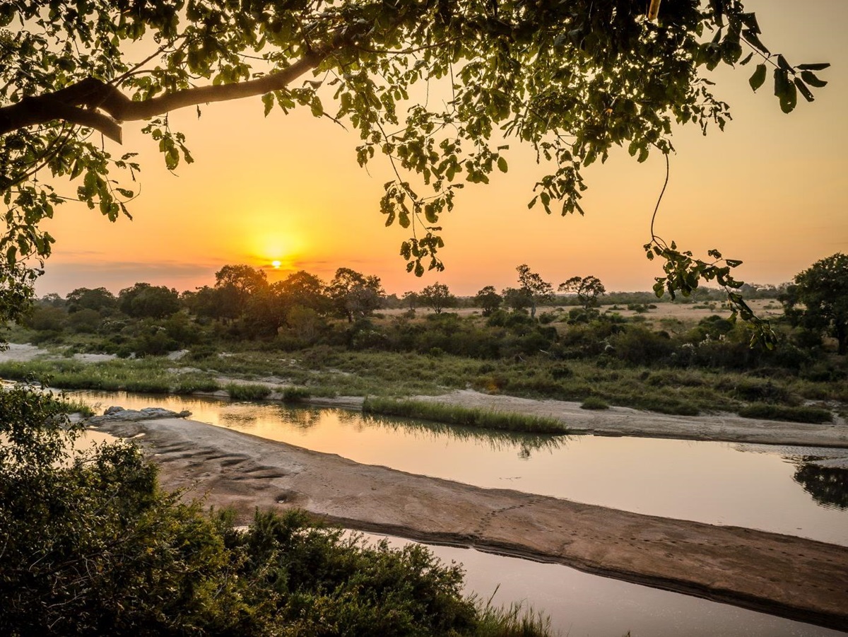 Sunset view over the river at Singita Boulders Lodge in South Africa