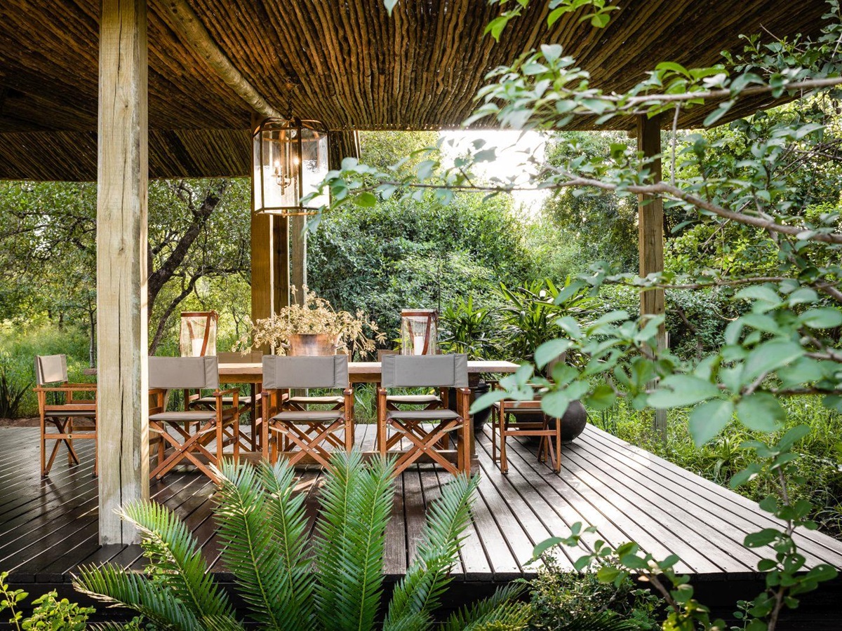 Dining on the outdoor deck at Singita Ebony Lodge in South Africa