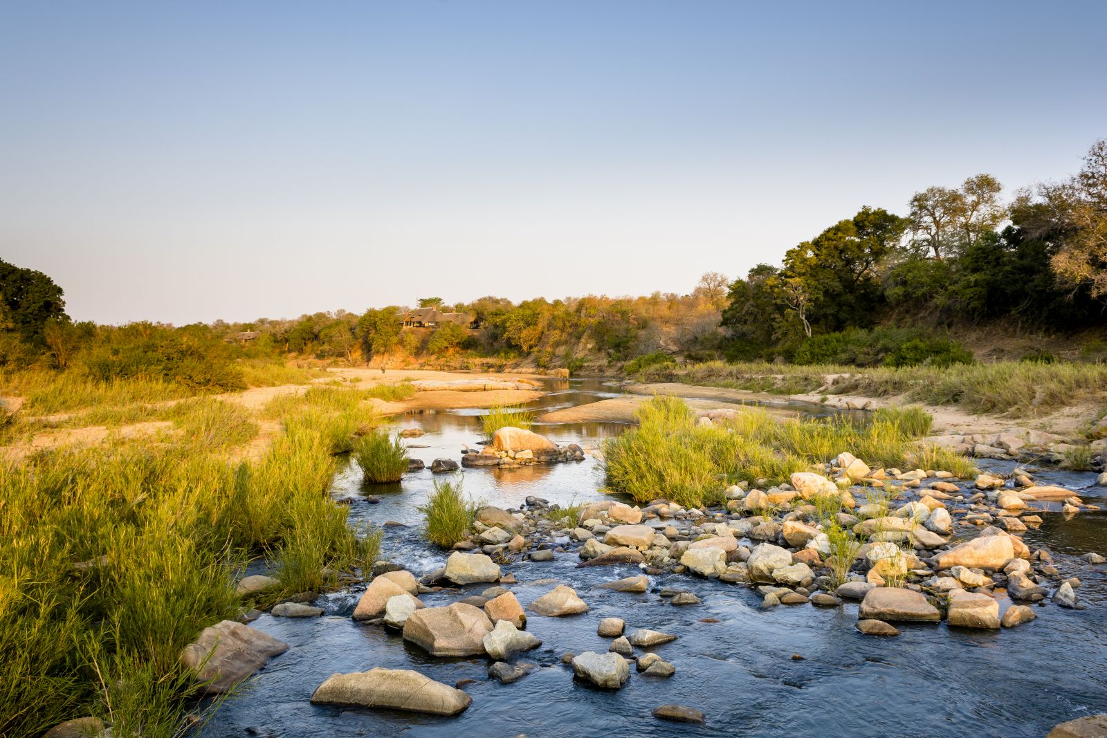 View across the river of Singita Ebony Lodge in South Africa