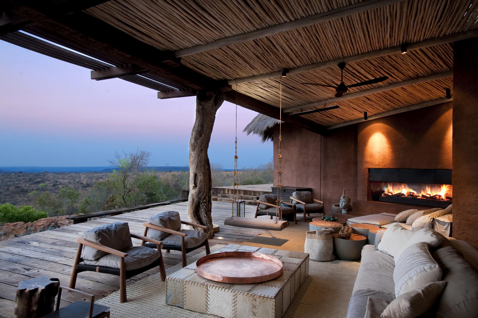 Outdoor covered terrace with fireplace at Leobo the Observatory, South Africa