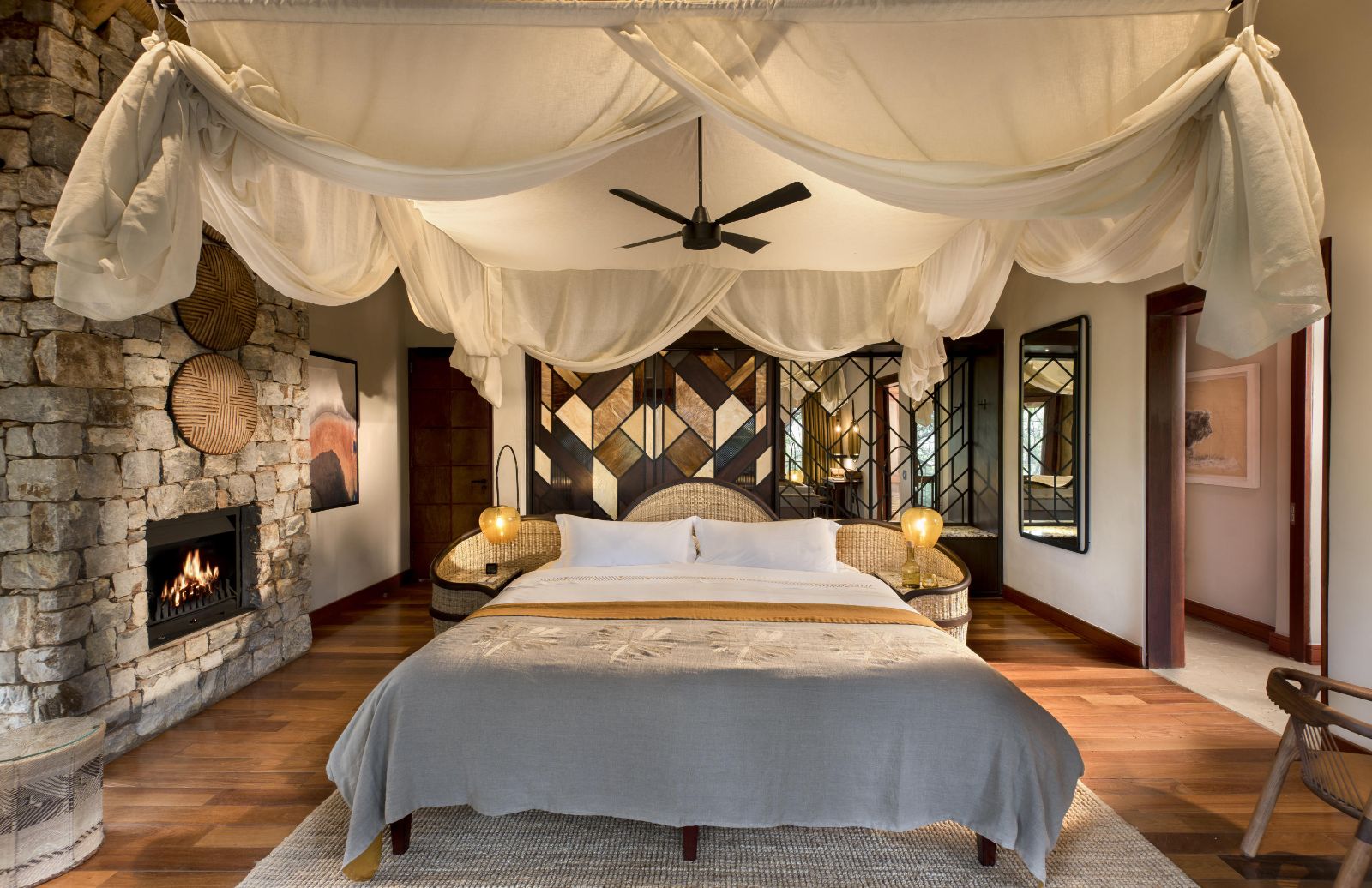 Double bedroom at luxury private house Morukuru River House in the Madikwe Game Reserve in South Africa with art deco and African design influences