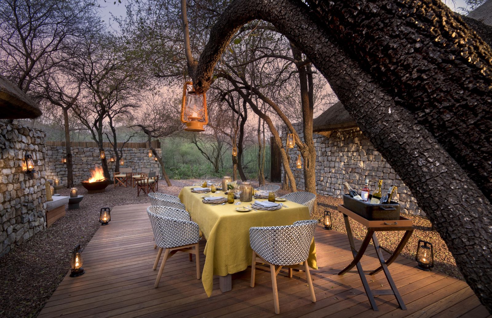 Lantern-lit outdoor seating area at luxury private house Morukuru River House in the Madikwe Game Reserve in South Africa