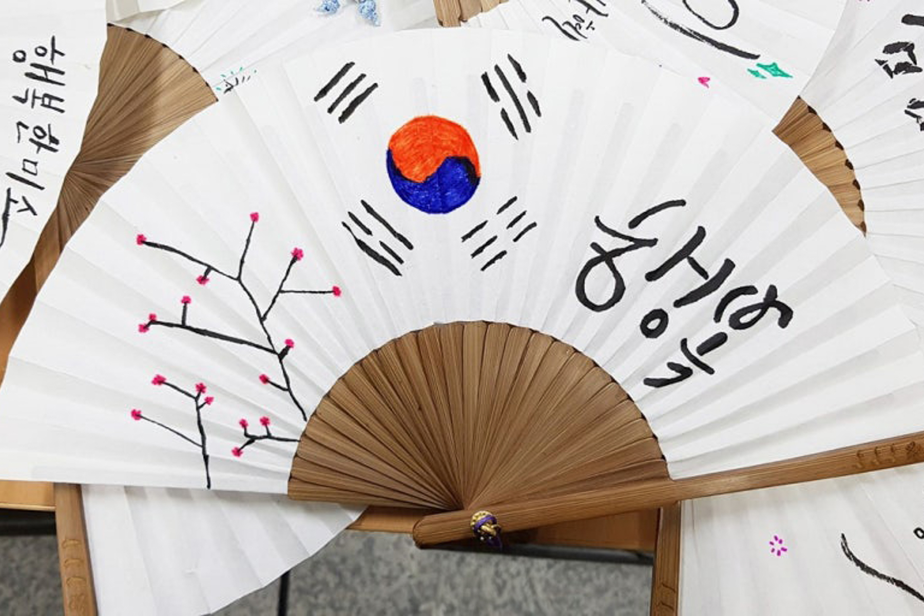 Korean calligraphy on a traditional fan