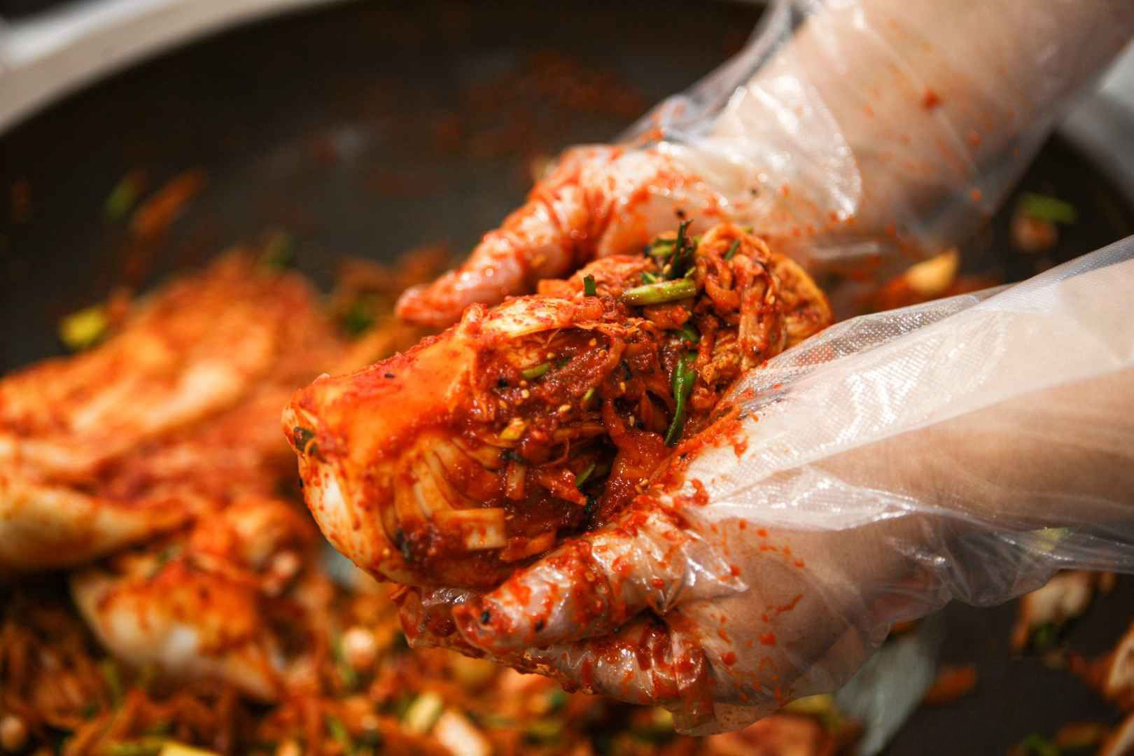 Close up view of kimchi being prepared during a Korean cookery class