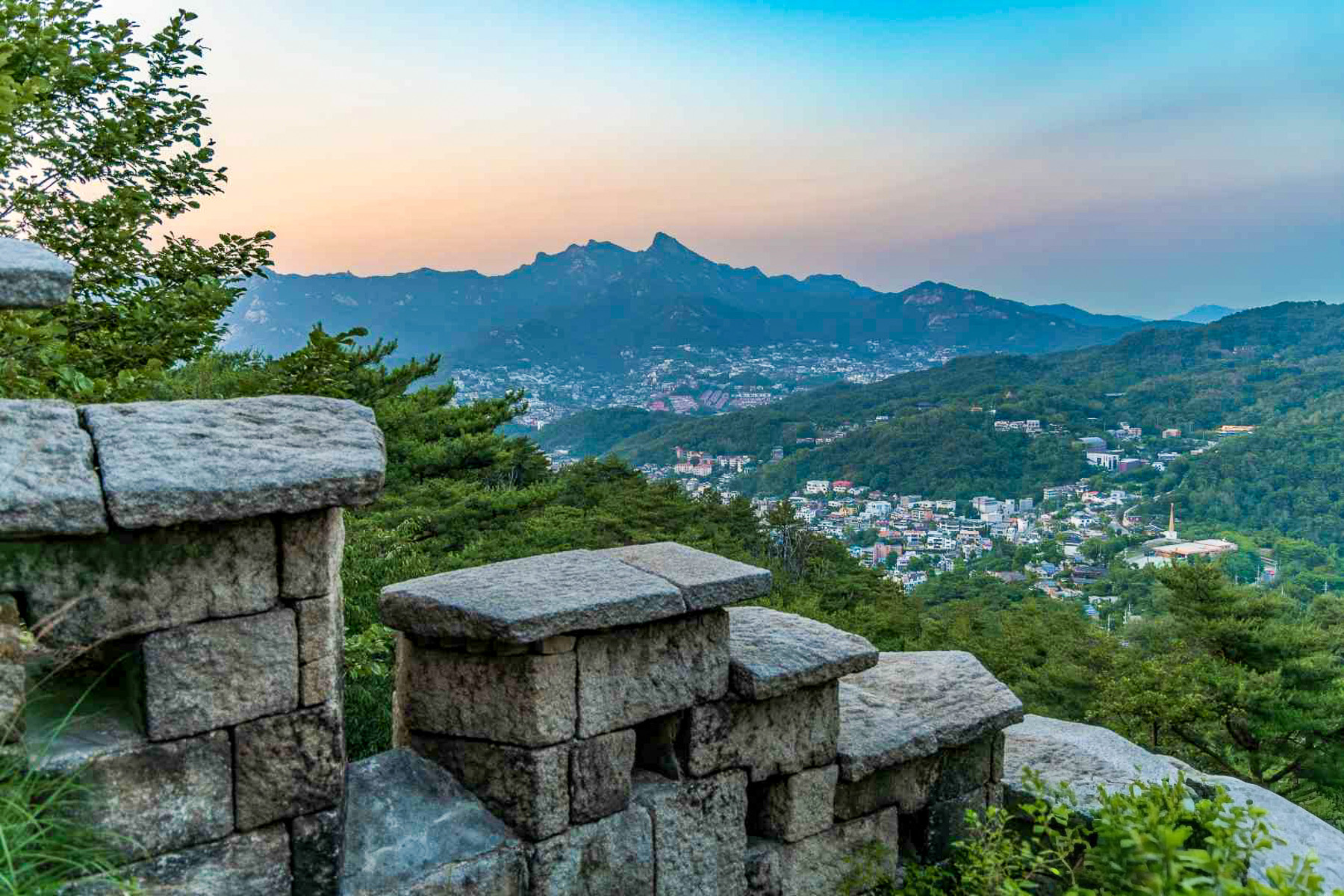 Views across Seoul during sunset from Inwangsan Mountain