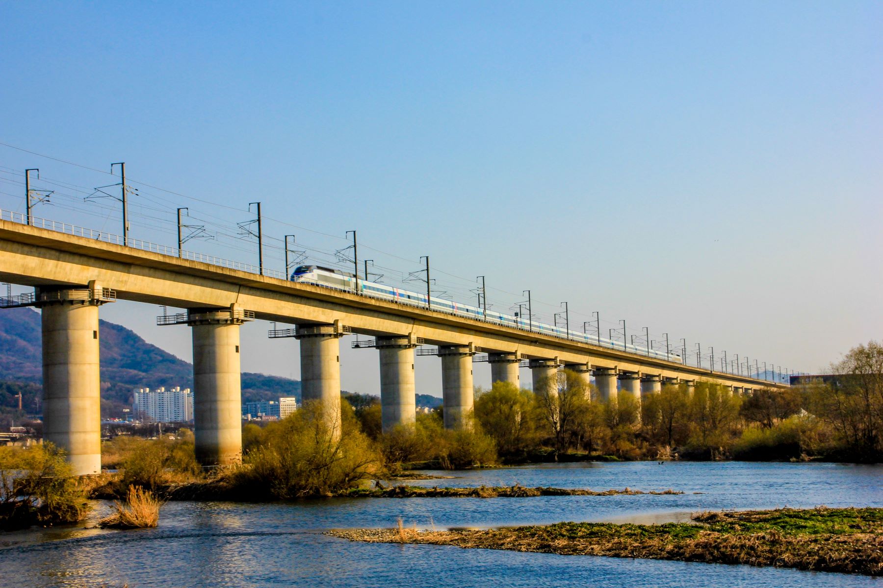 KTX train crossing a bridge in South Korea