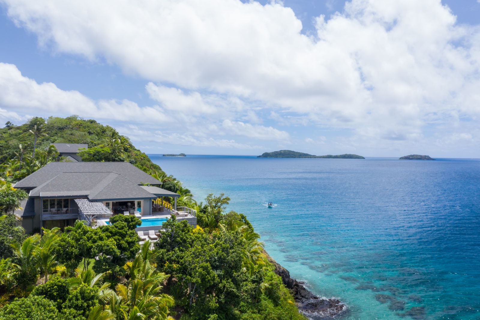 Aerial view of a Four Bedroom Residence by the turquoise waters of the Pacific Ocean at luxury resort Kokomo Island in Fiji