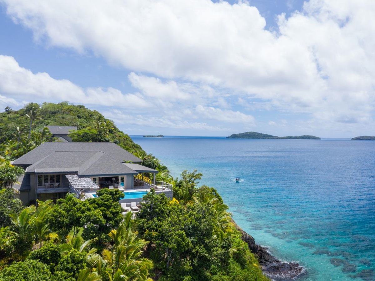Aerial view of a Four Bedroom Residence by the turquoise waters of the Pacific Ocean at luxury resort Kokomo Island in Fiji