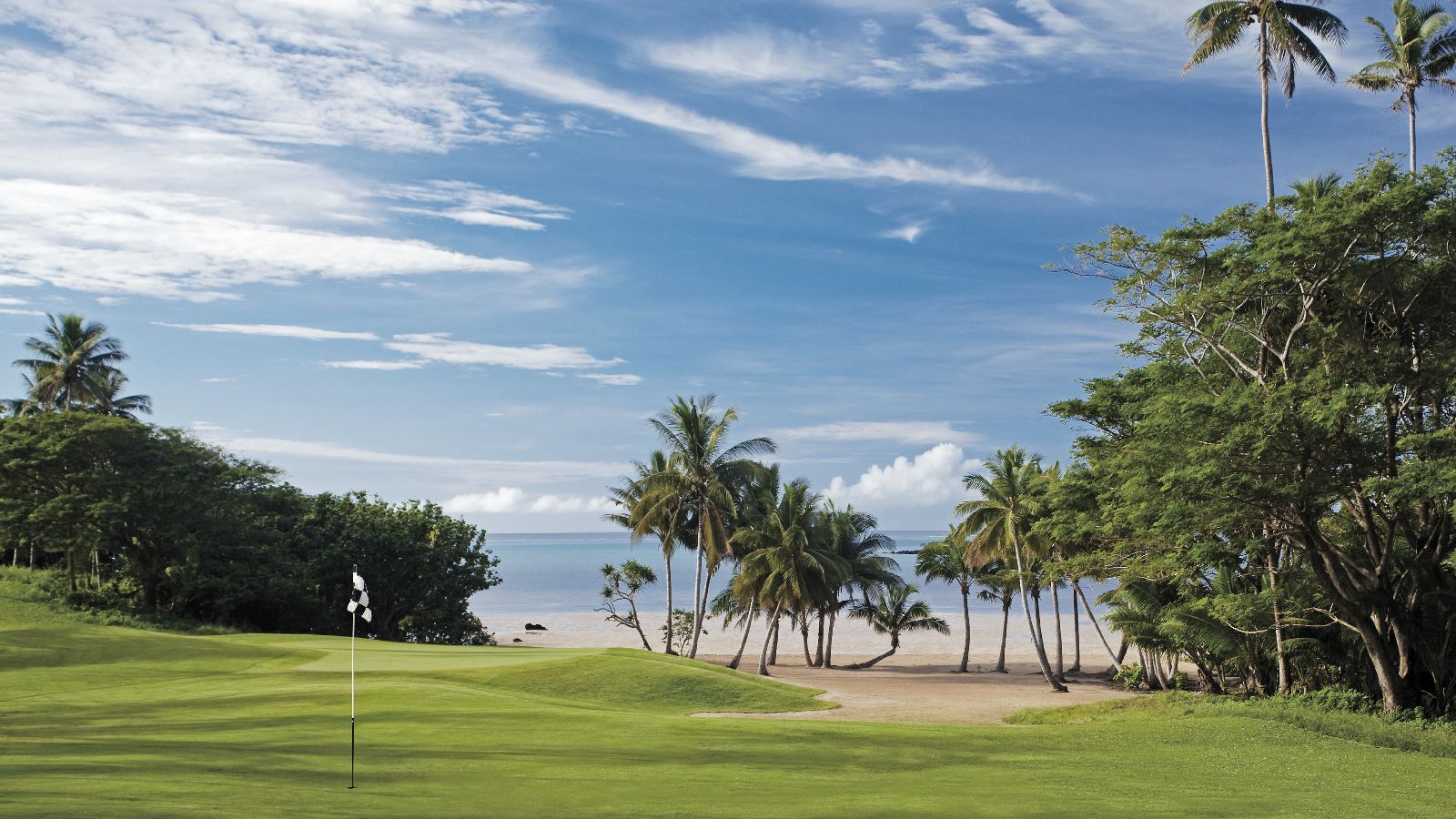 The palm fringed golf course at COMO Laucala Fiji