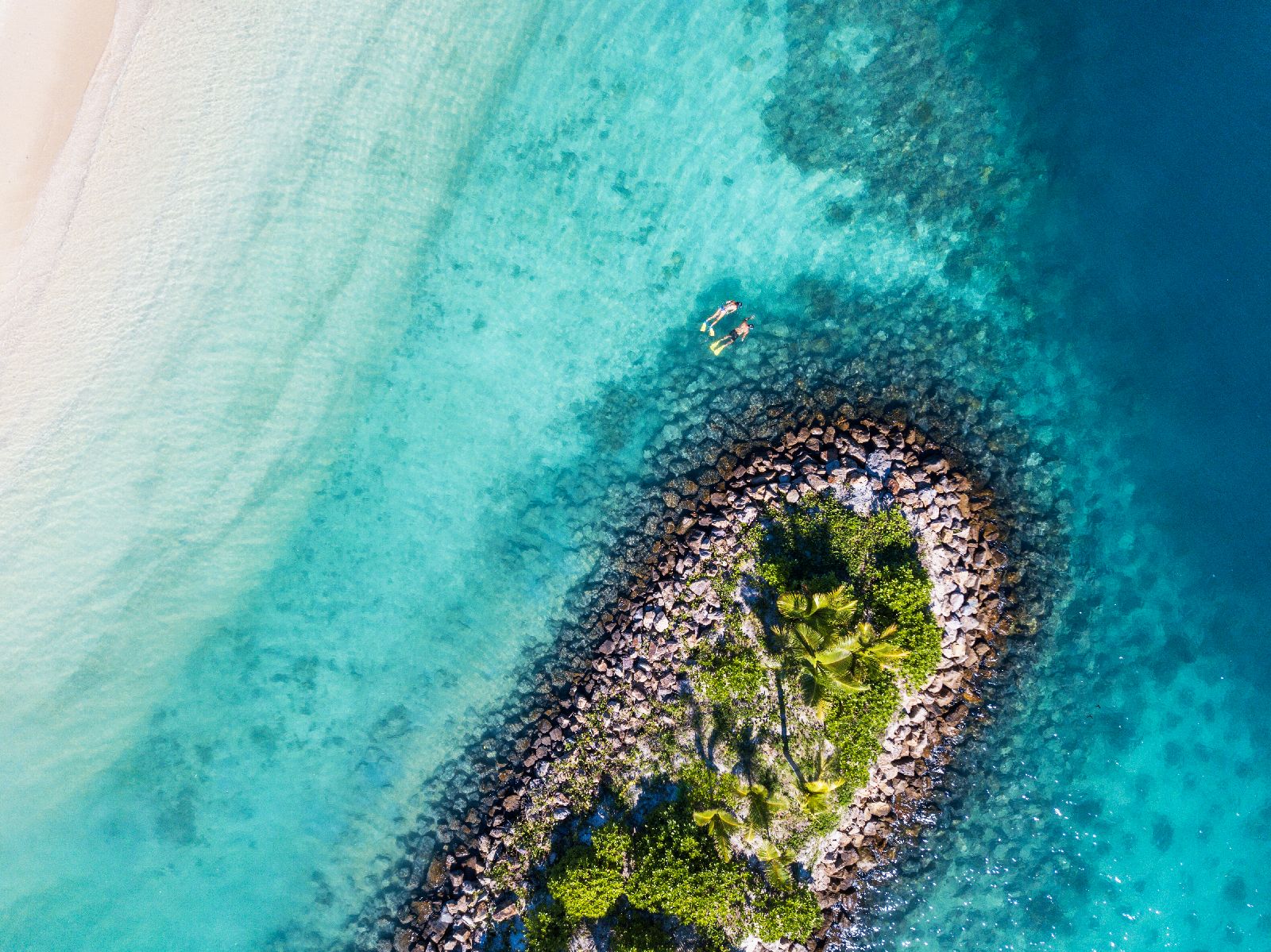 Snorkelling in the crystal clear waters at the Six Senses Fiji