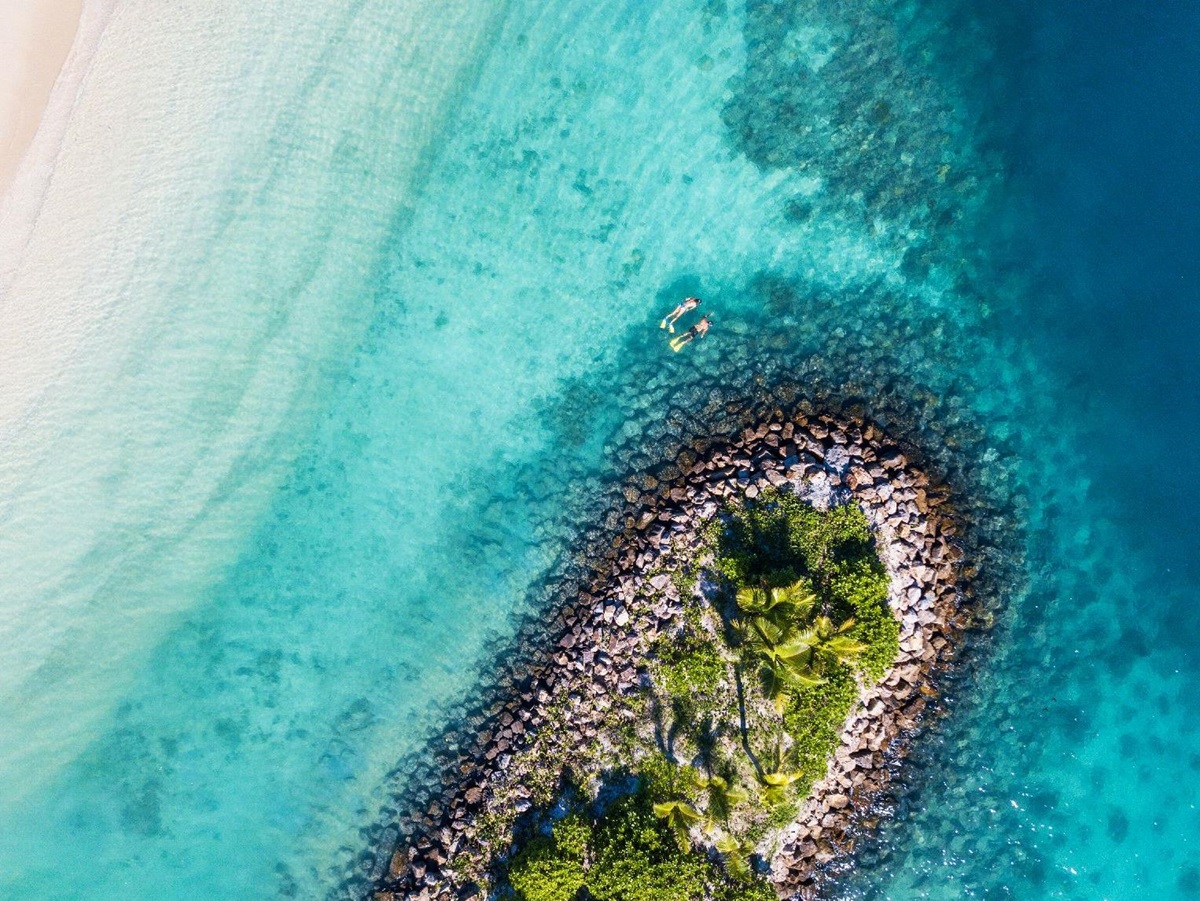Snorkelling in the crystal clear waters at the Six Senses Fiji