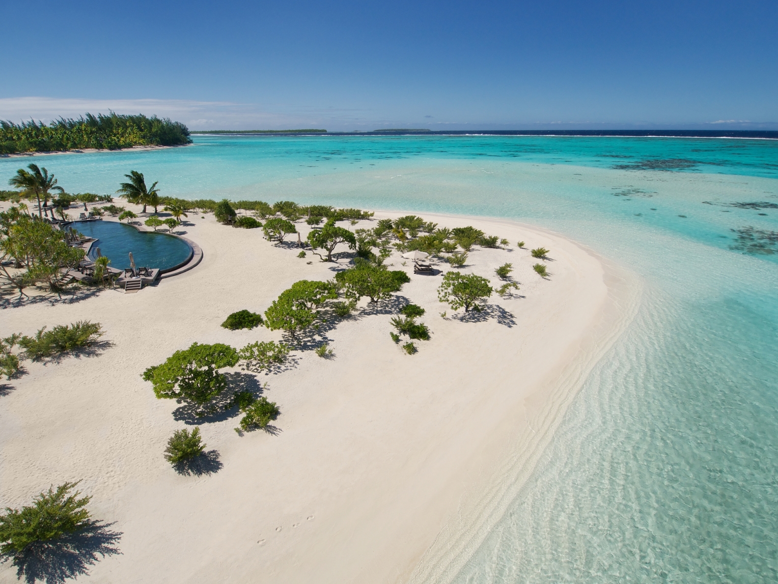 The pool and beach at the Brando in French Polynesia