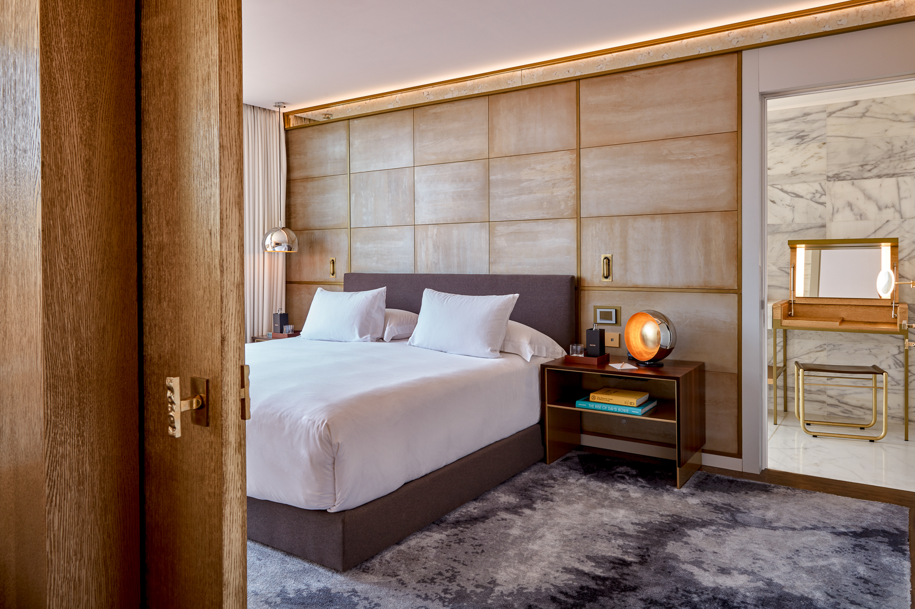 Guest suite bedroom at the Almanac Hotel