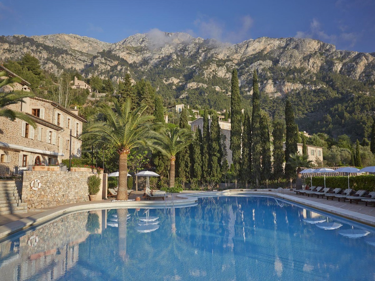 Swimming pool with mountain backdrop at Belmond La Residencia hotel in Mallorca