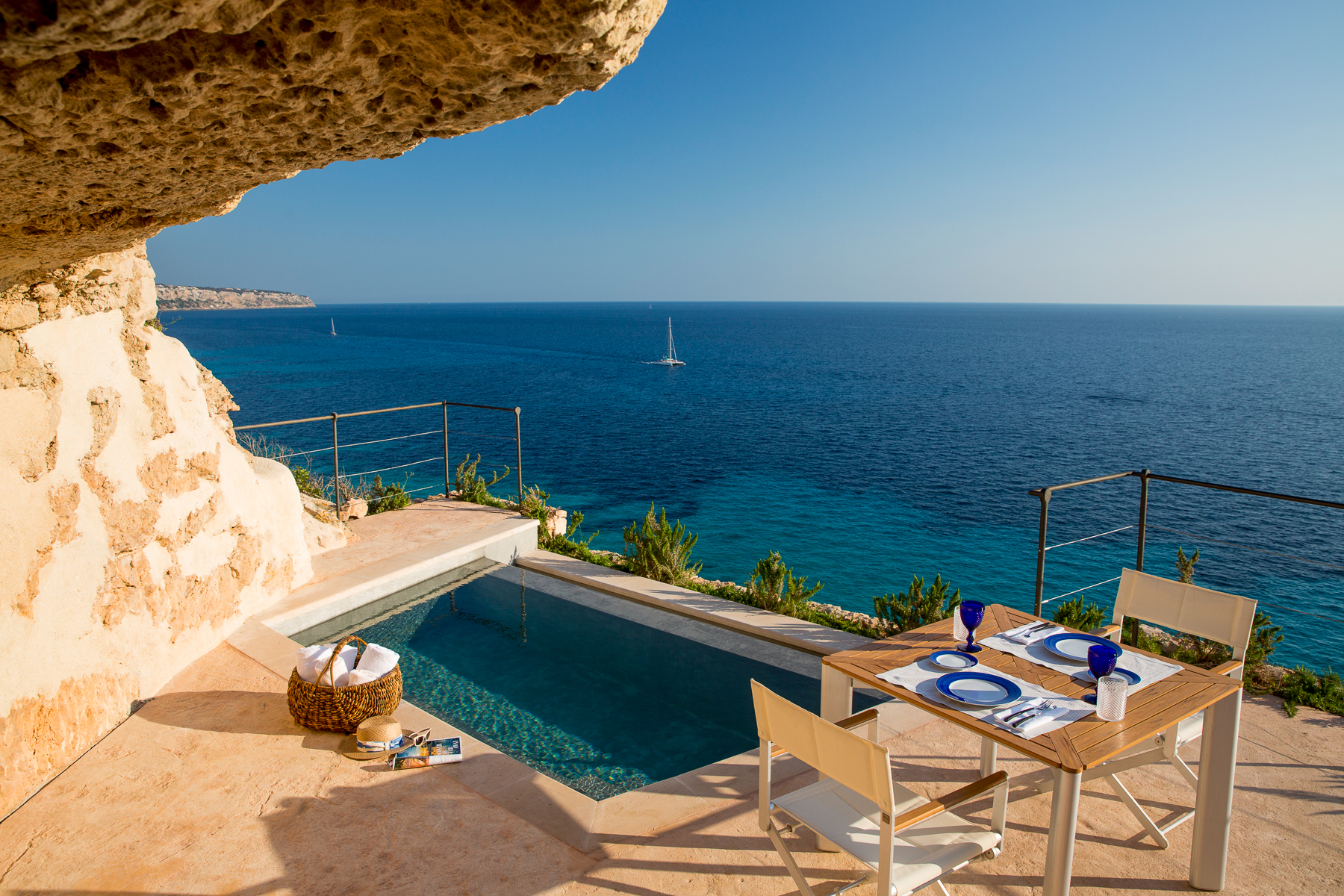 Alfresco dining set up overlooking the ocean at Cap Rocat in Mallorca