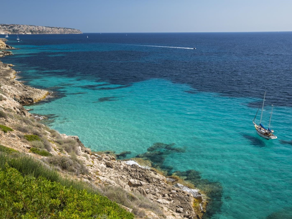 A boat on the turquoise waters of the Mediterranean Sea