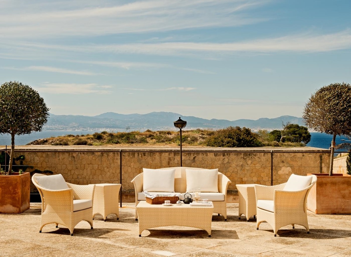 Terrace seating with views across the bay at luxury resort Cap Rocat on Mallorca, Spain