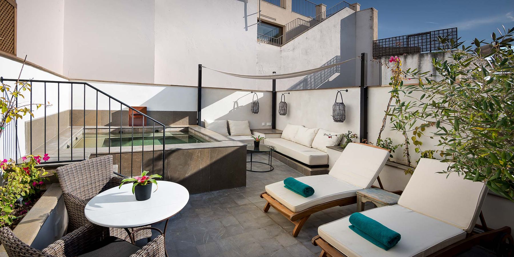 Plunge pool and loungers on the terrace of Corral del Rey in Andalusia