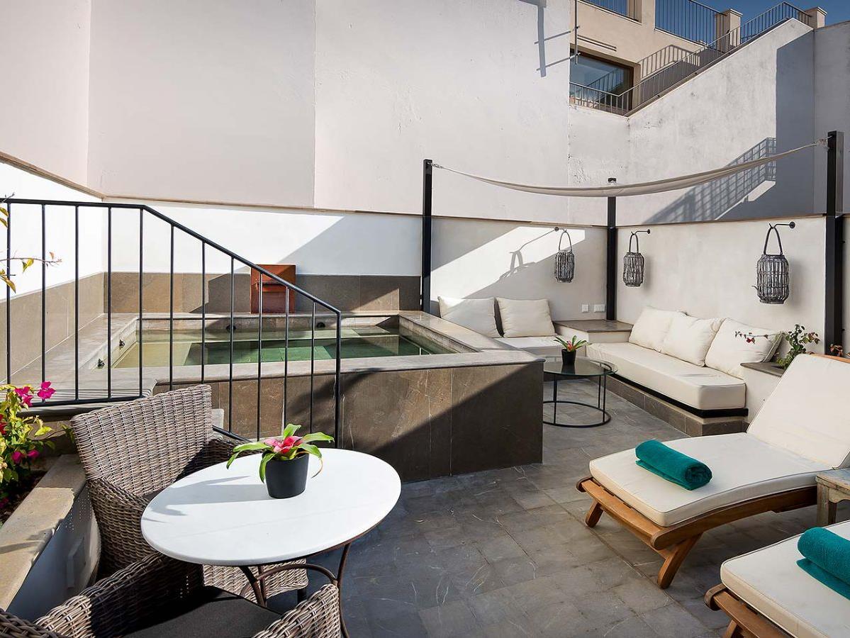 Plunge pool and loungers on the terrace of Corral del Rey in Andalusia