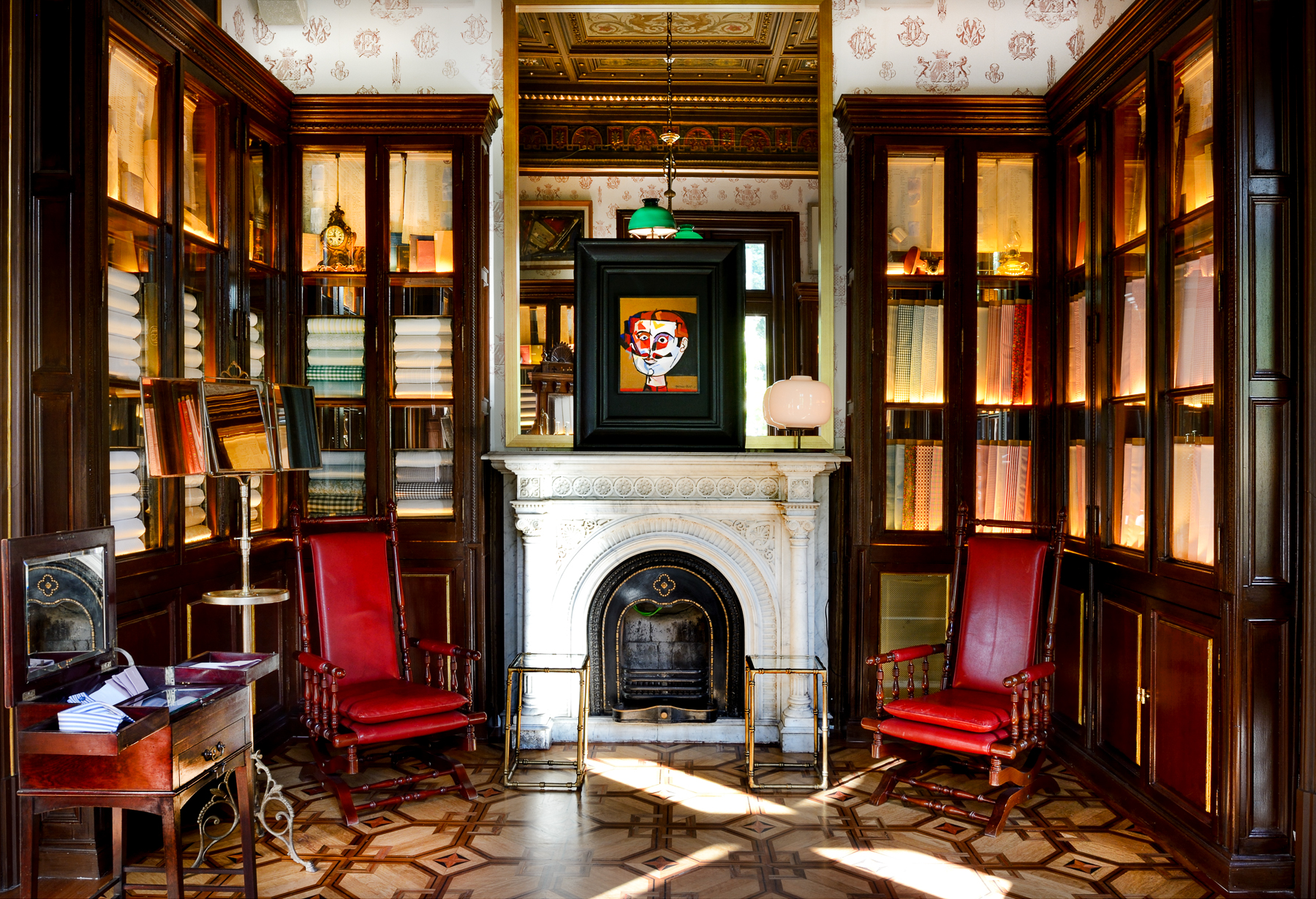 Atelier with wooden panelling and fireplace at the Cotton House Hotel in Barcelona