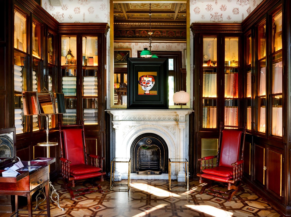 Atelier with wooden panelling and fireplace at the Cotton House Hotel in Barcelona