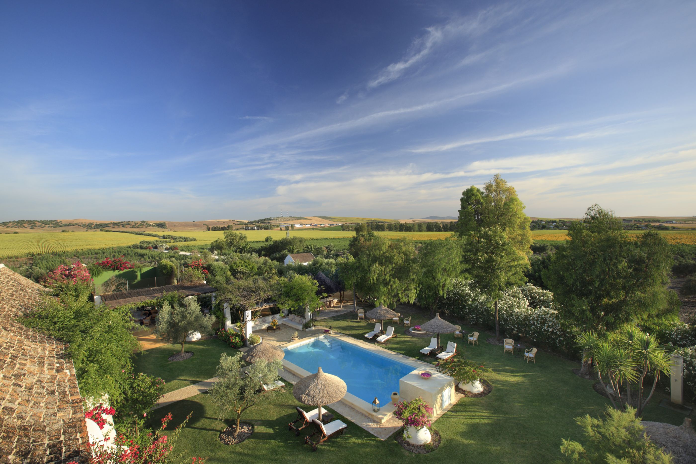 The garden with swimming pool of Hacienda de San Rafael, Spain