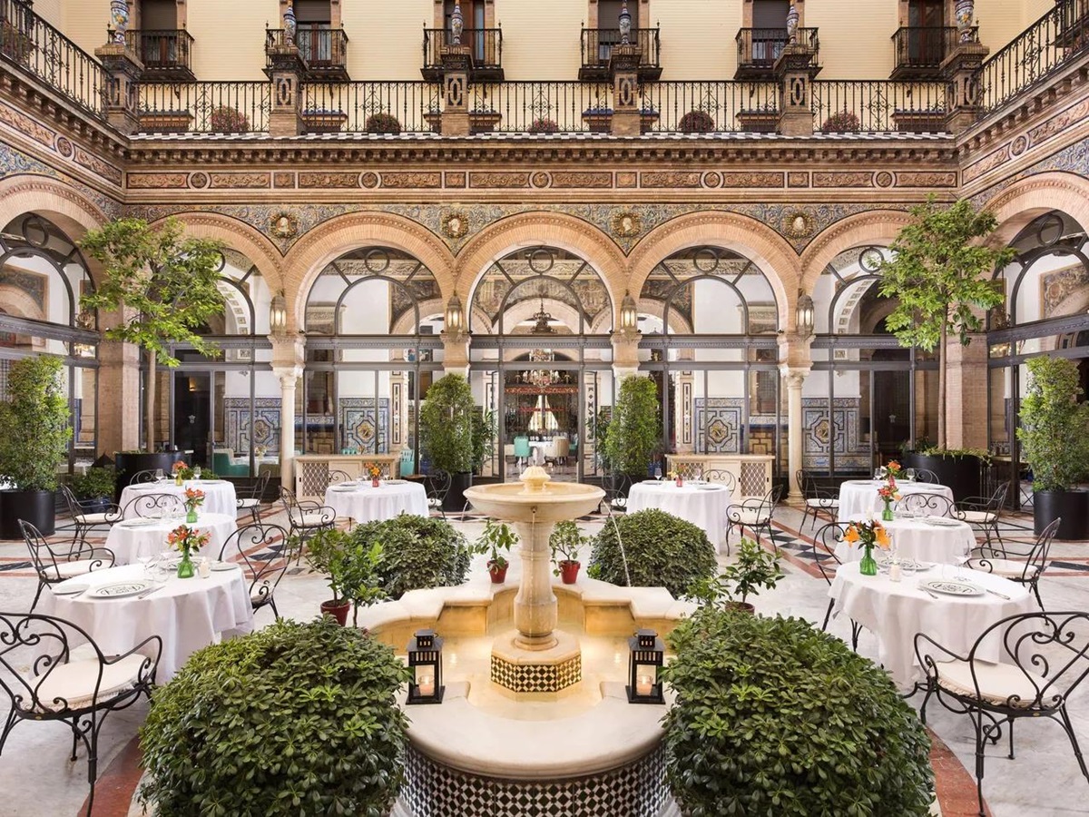 Bright central courtyard and fountain at Hotel Alfonso XIII Seville