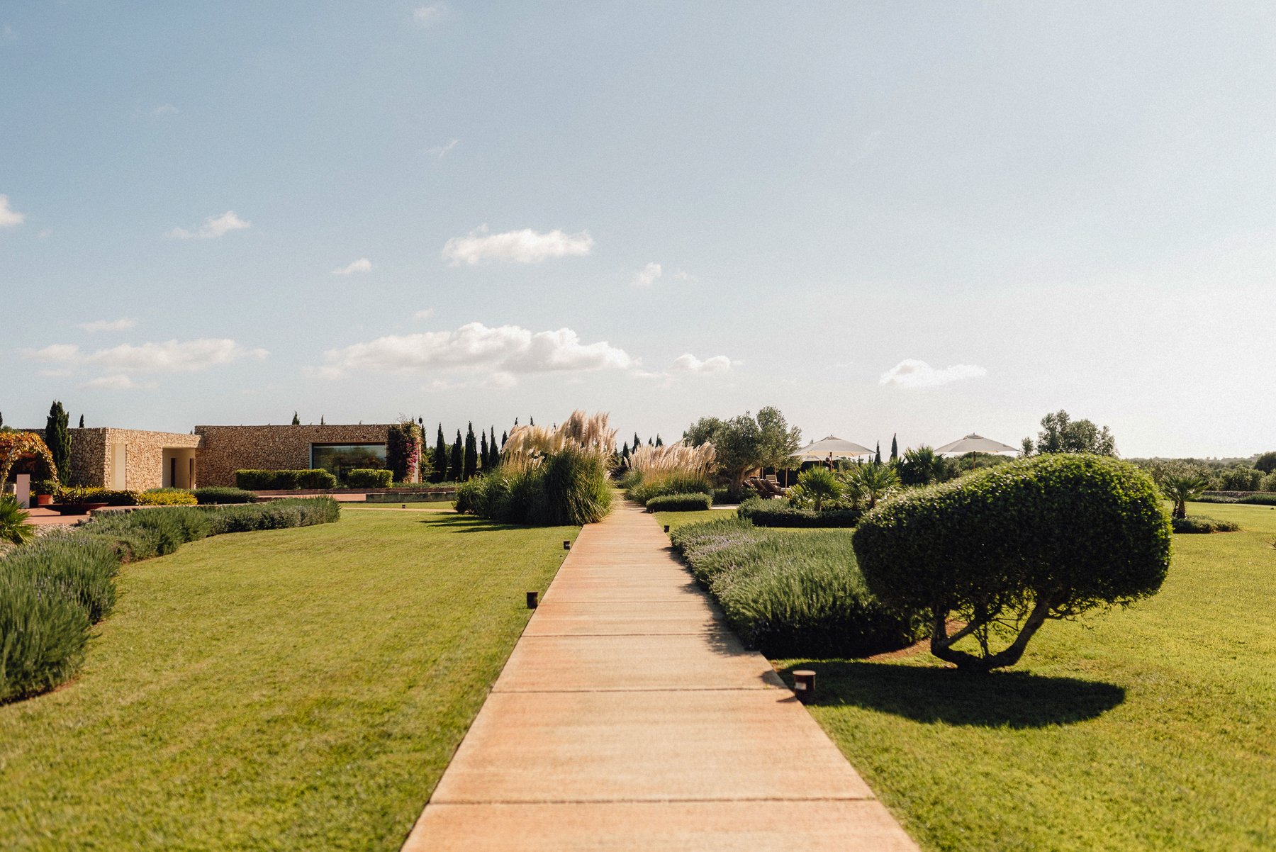 A pathway running through the gardens of Hotel Torralbenc in Menorca