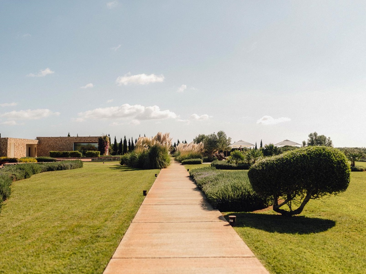 A pathway running through the gardens of Hotel Torralbenc in Menorca