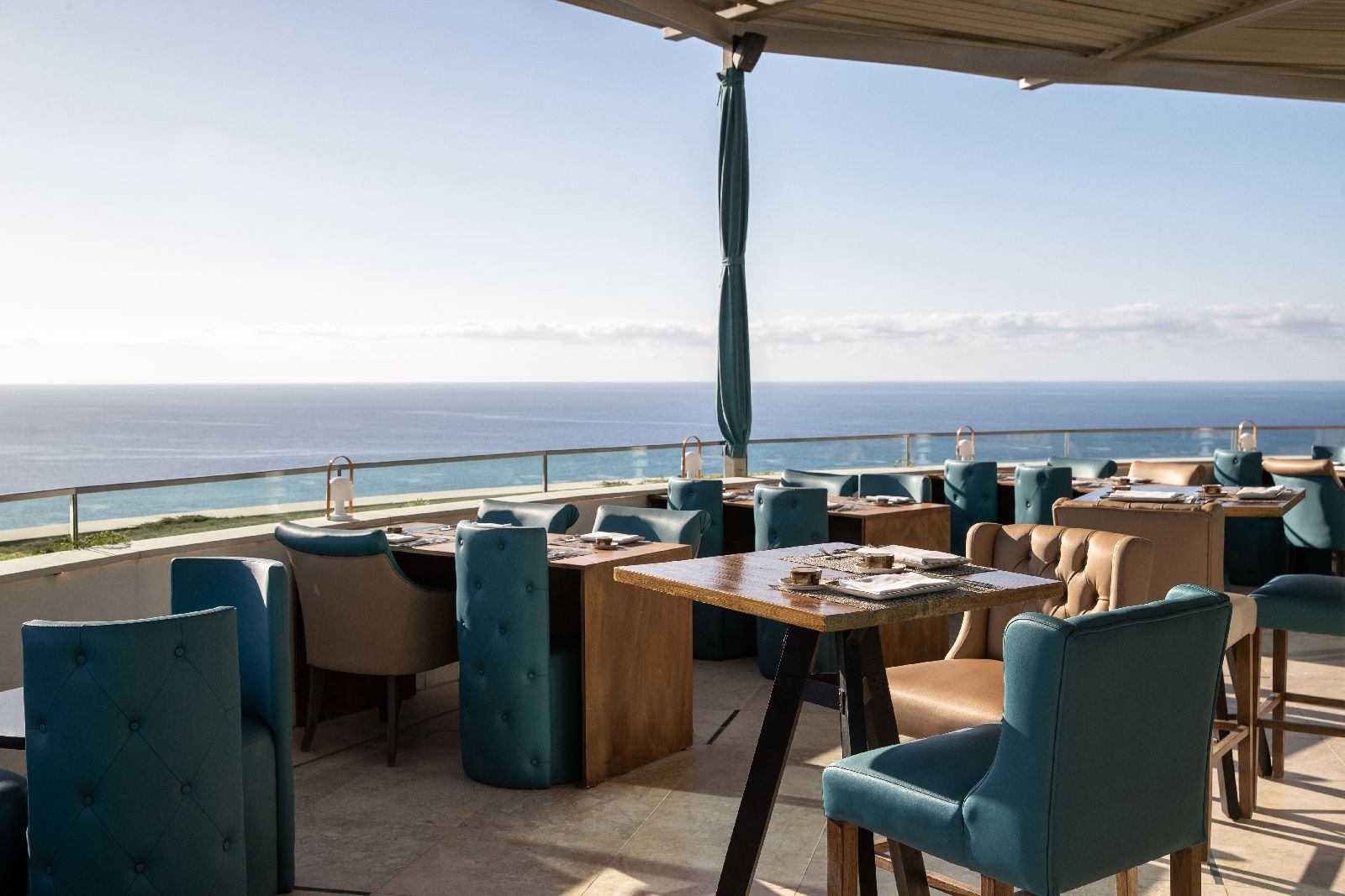 Outdoor dining terrace with sea views at the Jumeirah Port Soller hotel in Mallorca