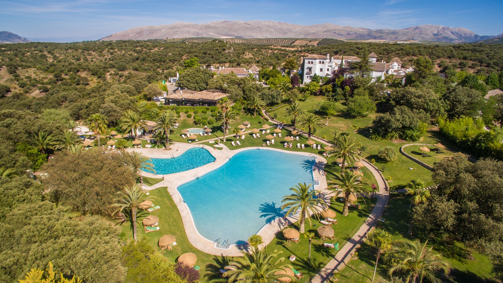 Aerial view of pool and surrounding gardens at La Bobadilla in Granada Spain