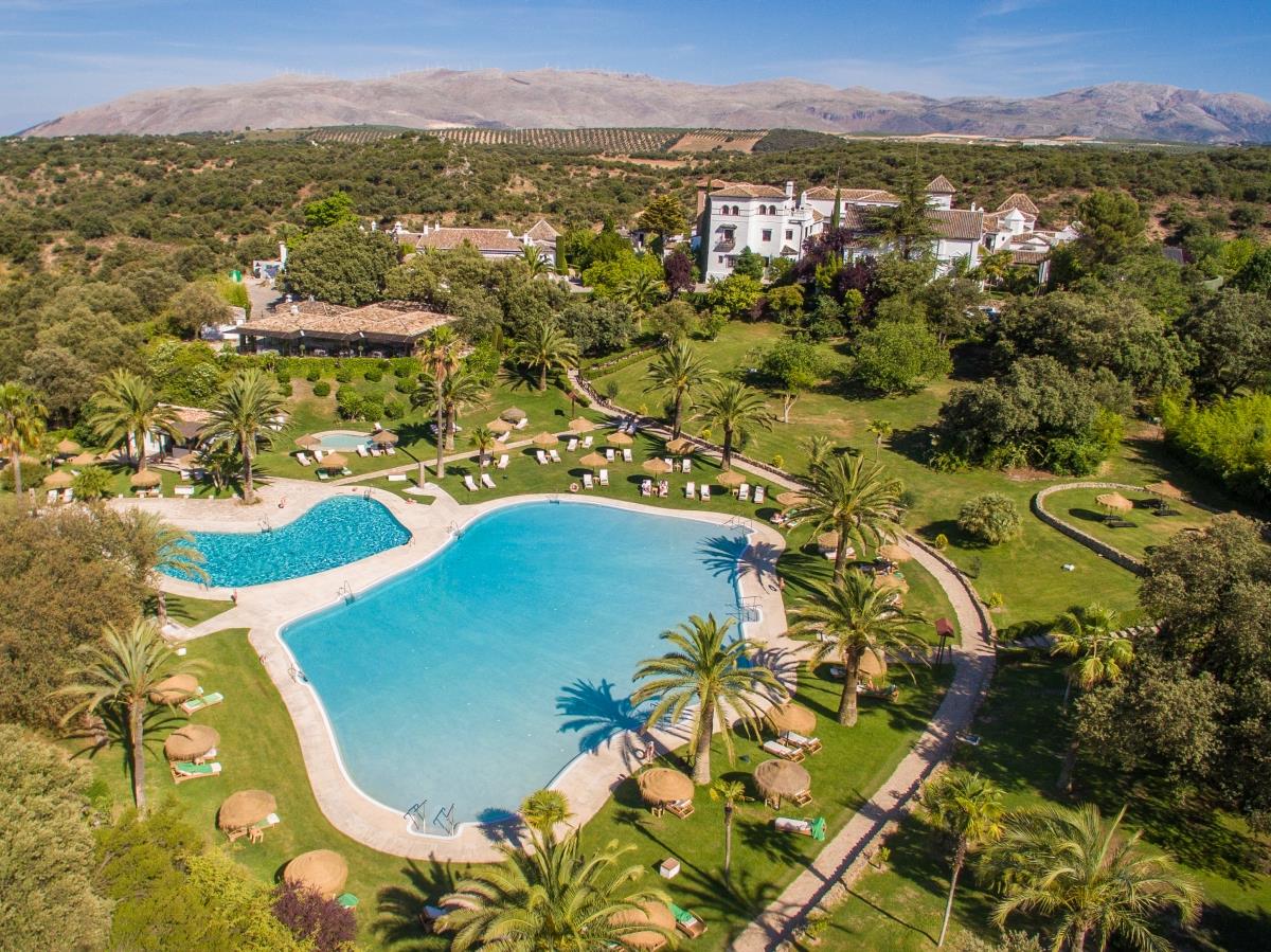 Aerial view of pool and surrounding gardens at La Bobadilla in Granada Spain