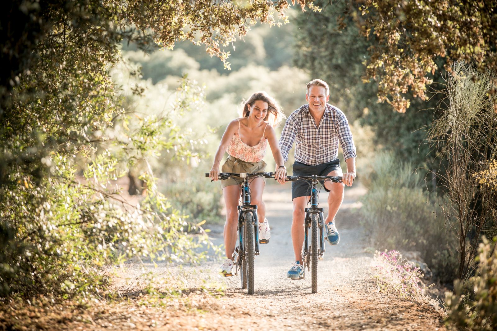 Guests exploring the surround area on bicycles at luxury resort La Bobadilla near Grenada, Spain