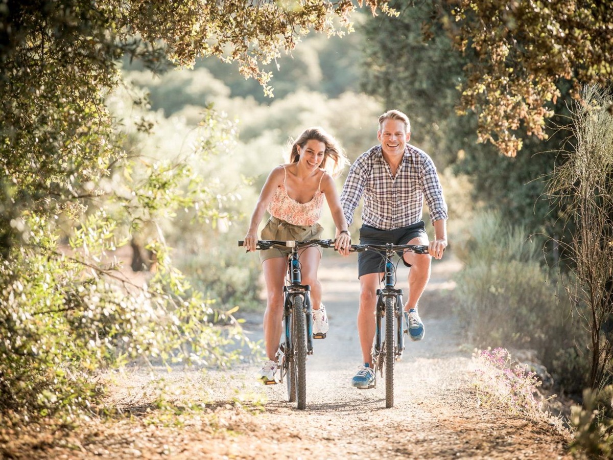 Guests exploring the surround area on bicycles at luxury resort La Bobadilla near Grenada, Spain