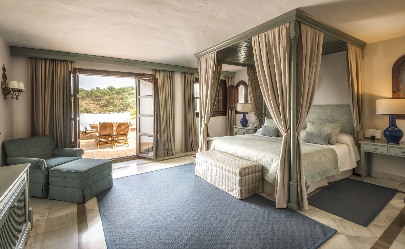 Bedroom with terrace of a Deluxe Suite at luxury resort La Bobadilla near Grenada, Spain
