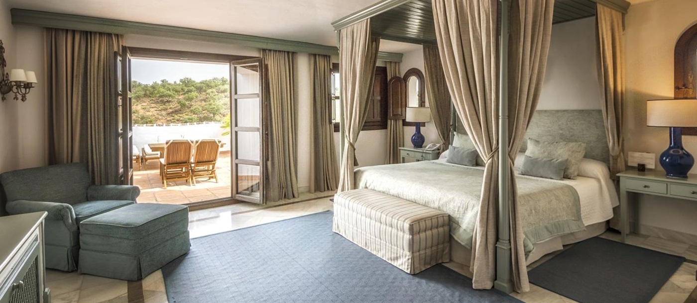 Bedroom with terrace of a Deluxe Suite at luxury resort La Bobadilla near Grenada, Spain