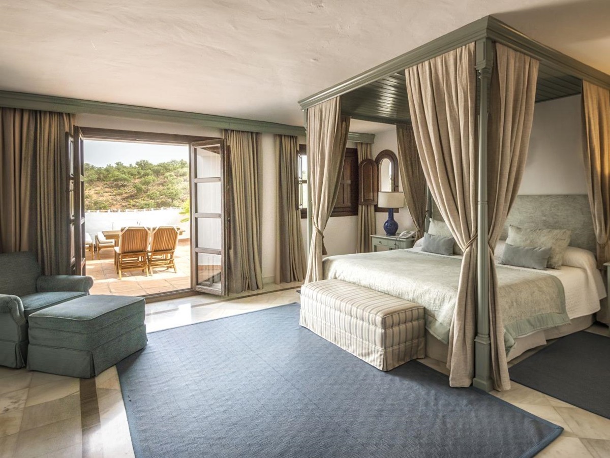 Bedroom with terrace of a Deluxe Suite at luxury resort La Bobadilla near Grenada, Spain