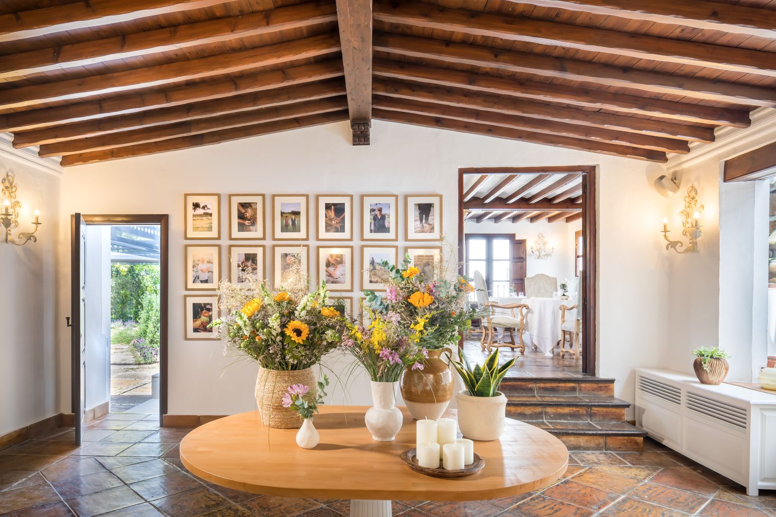 Welcoming foyer at luxury resort La Bobadilla near Grenada, Spain with sunflowers and rustic art