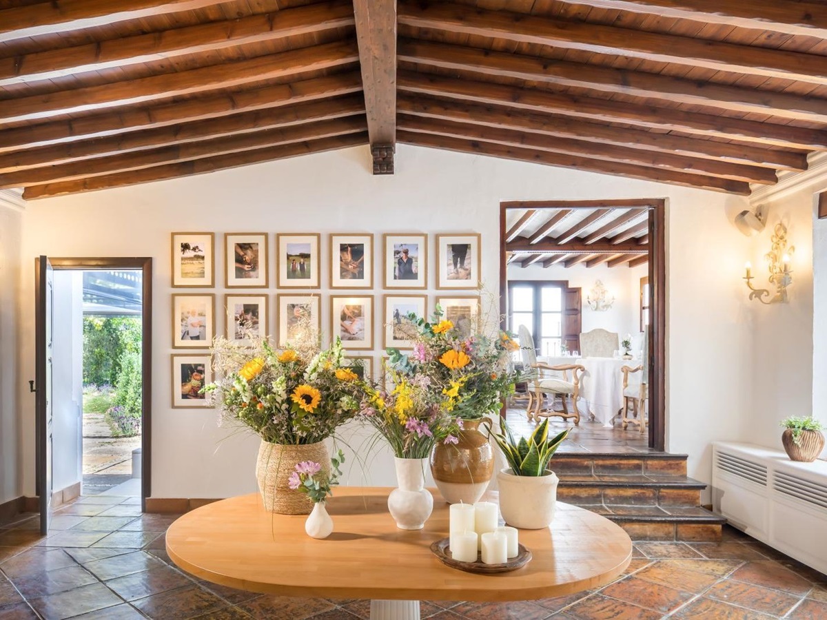 Welcoming foyer at luxury resort La Bobadilla near Grenada, Spain with sunflowers and rustic art