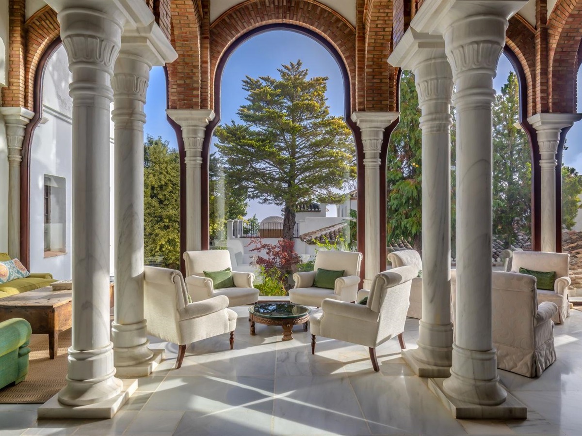 Foyer with columns and archways into the gardens at luxury resort La Bobadilla near Grenada, Spain