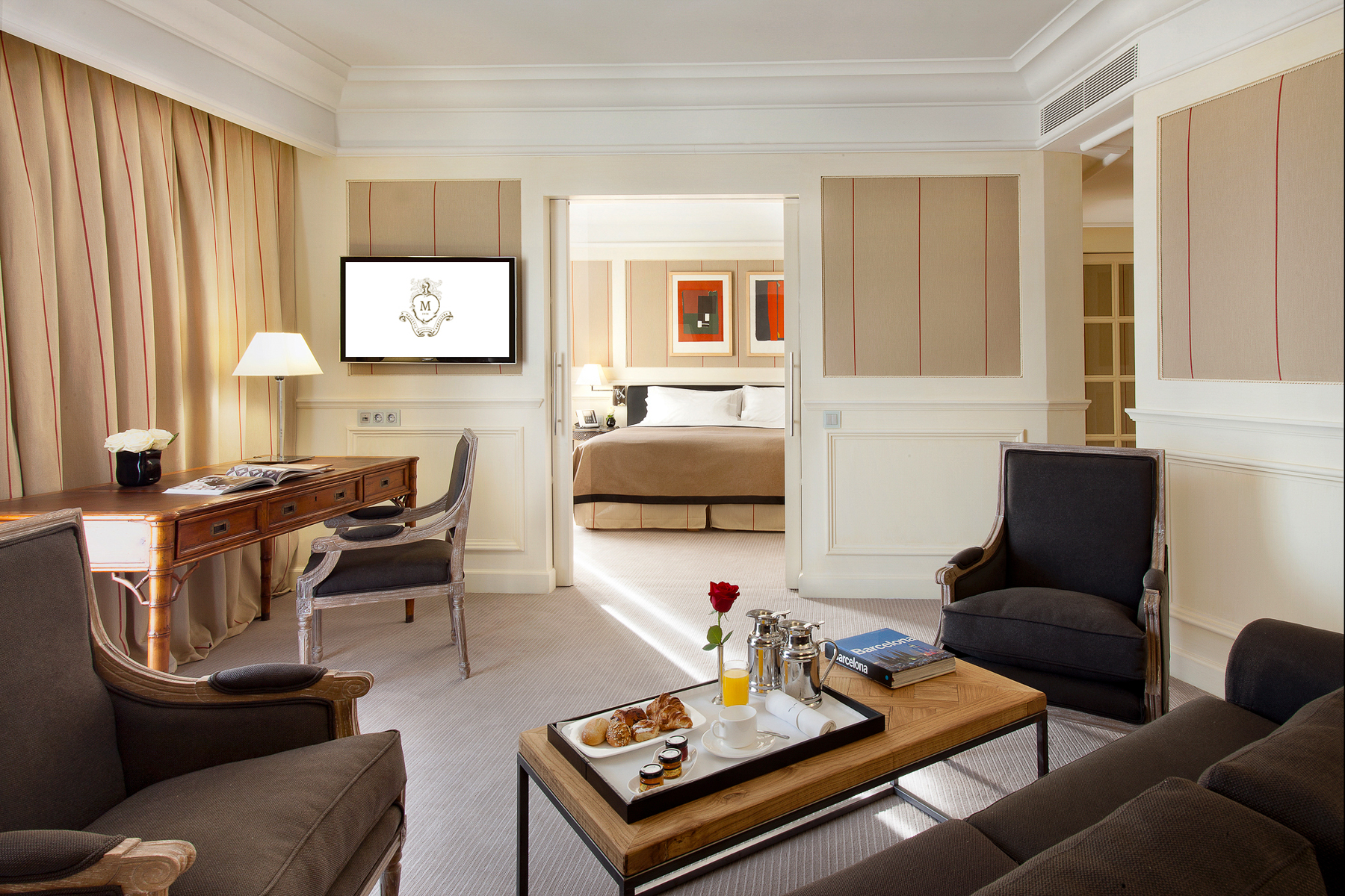 Bedroom and living area inside a guest suite at the Majestic Hotel & Spa in Barcelona