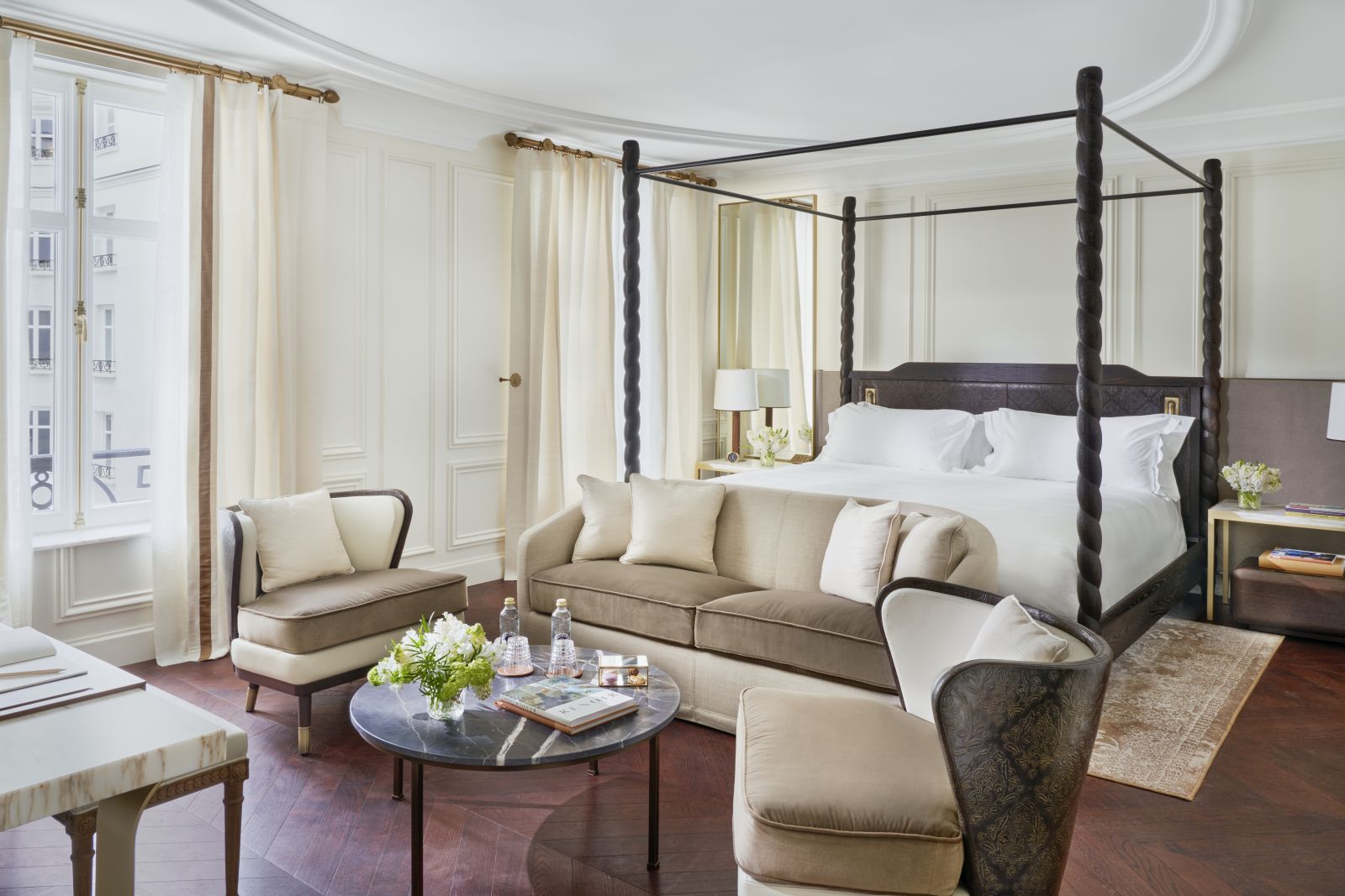 Spacious bedroom with sitting area of a Junior Suite at luxury hotel Mandarin Oriental Ritz Madrid
